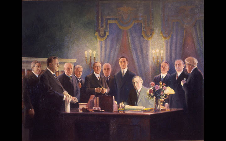 President Wilson signing the Federal Reserve Act