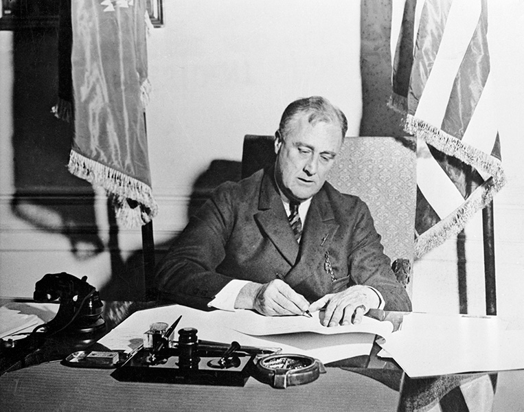 President Franklin Roosevelt signing the Emergency Banking Act